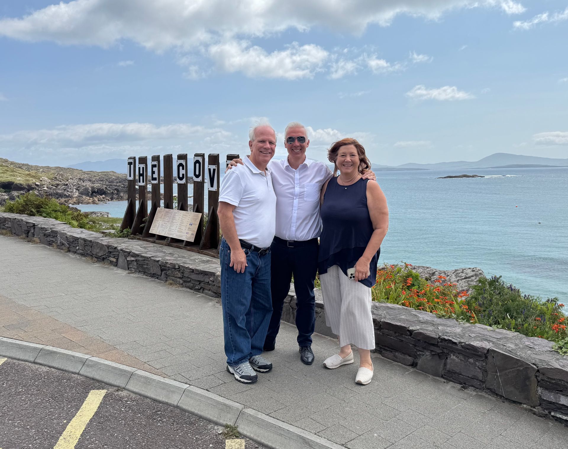 Three people stand in front of 