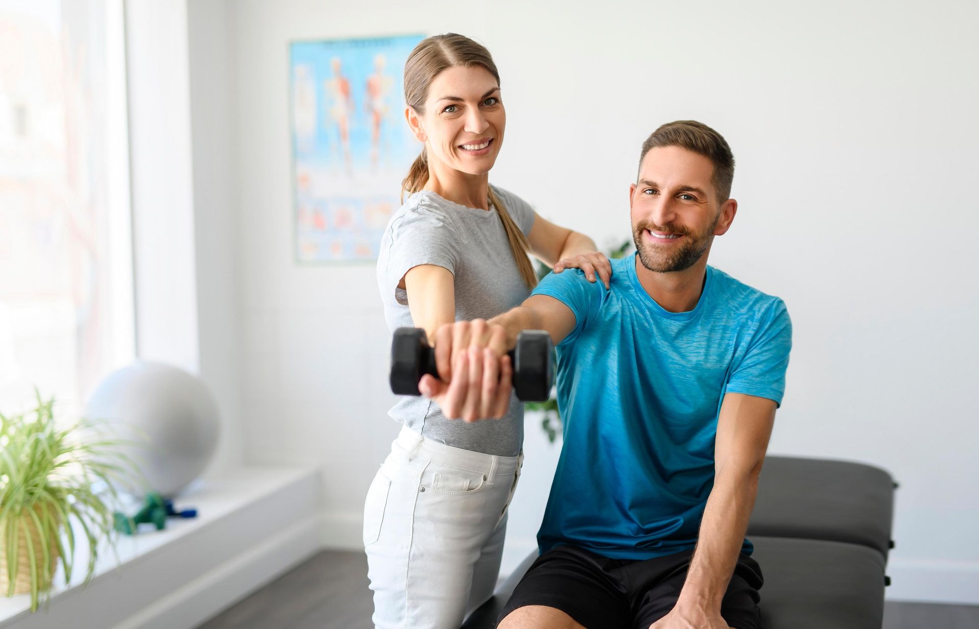 Hands supporting a bent knee during a physical therapy session