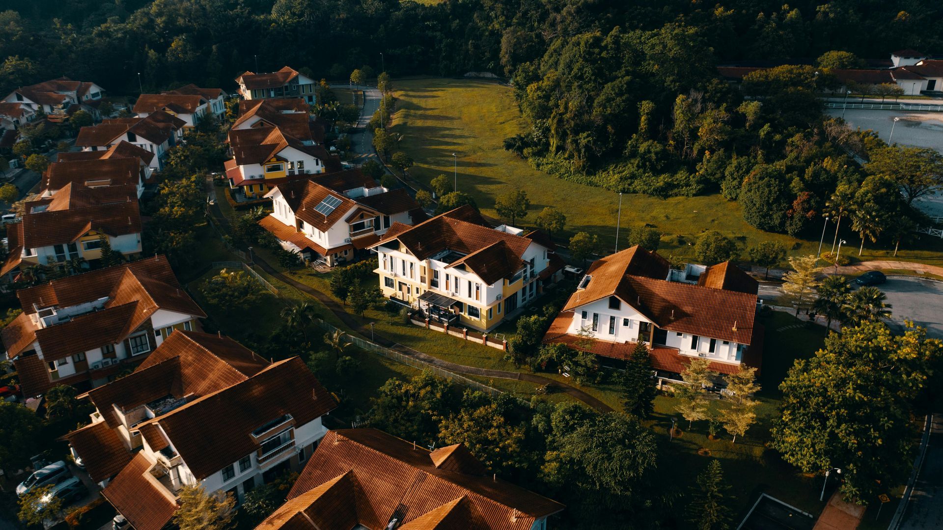 An aerial view of a residential area with lots of houses and trees.