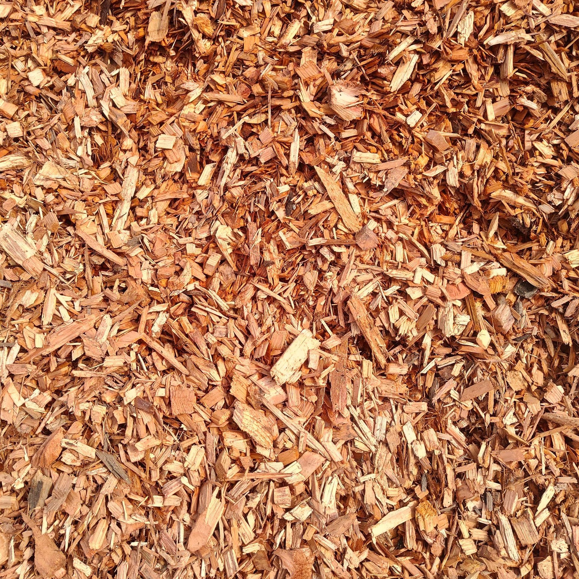 Pile of light brown wood chips and bark mulch