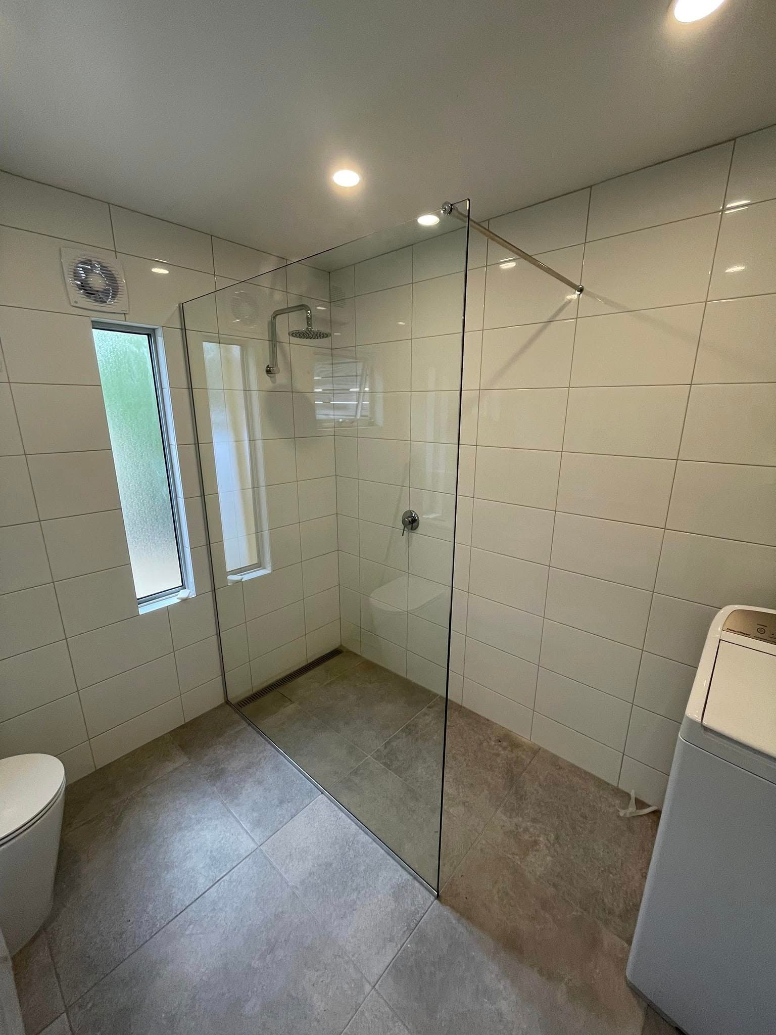 A Modern Bathroom Featuring a Walk-in Shower With a Glass Panel — Channel Glazing In Electrona, TAS