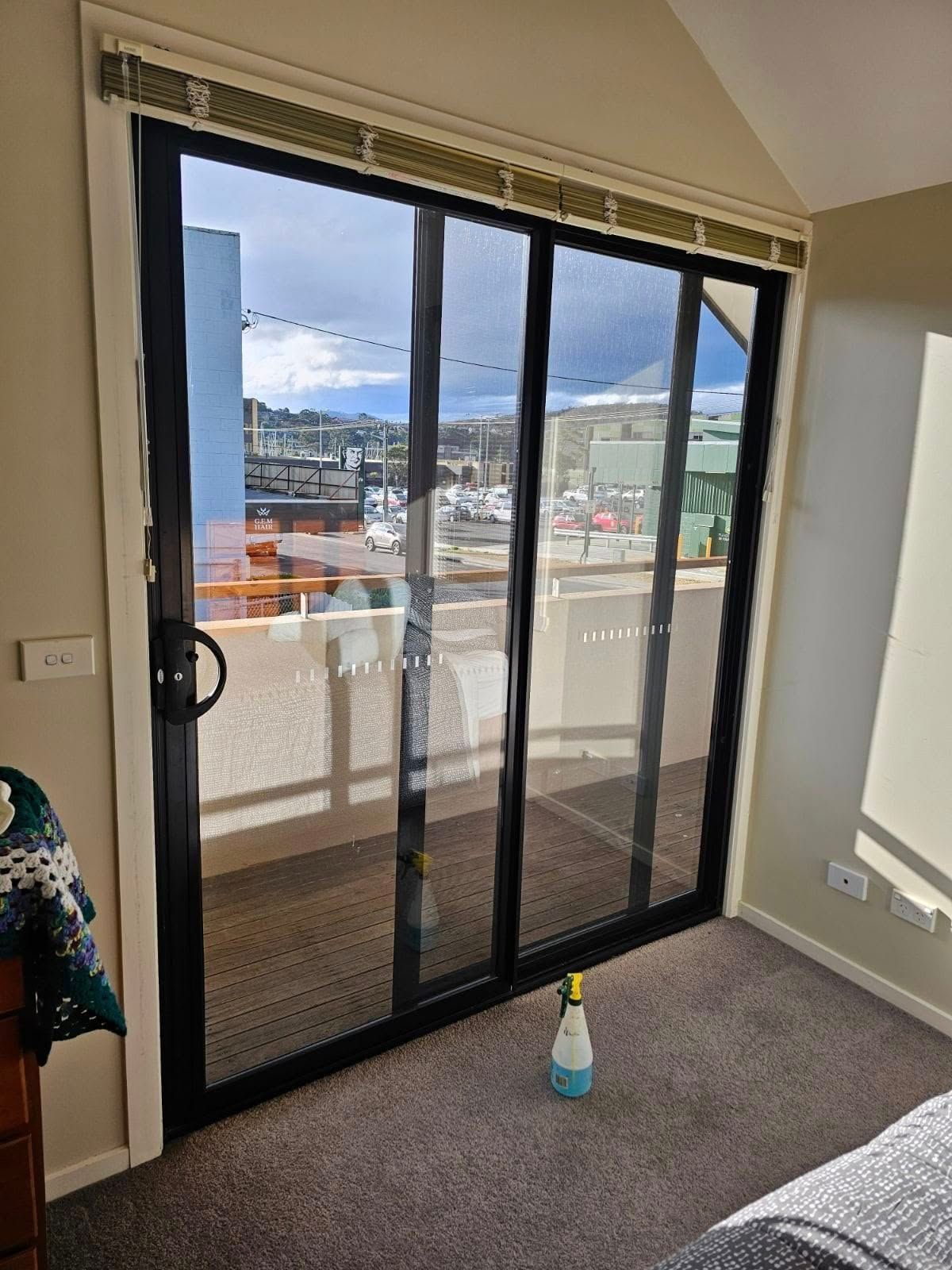 A Black Sliding Glass Door Leading to a Balcony — Channel Glazing In Electrona, TAS