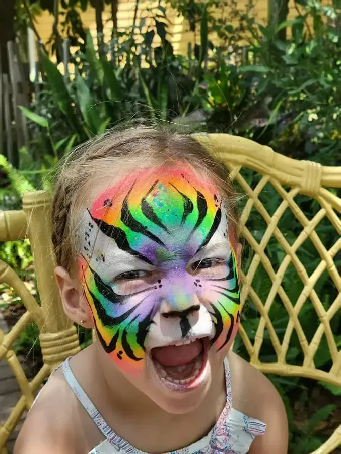a girl with tiger face painting