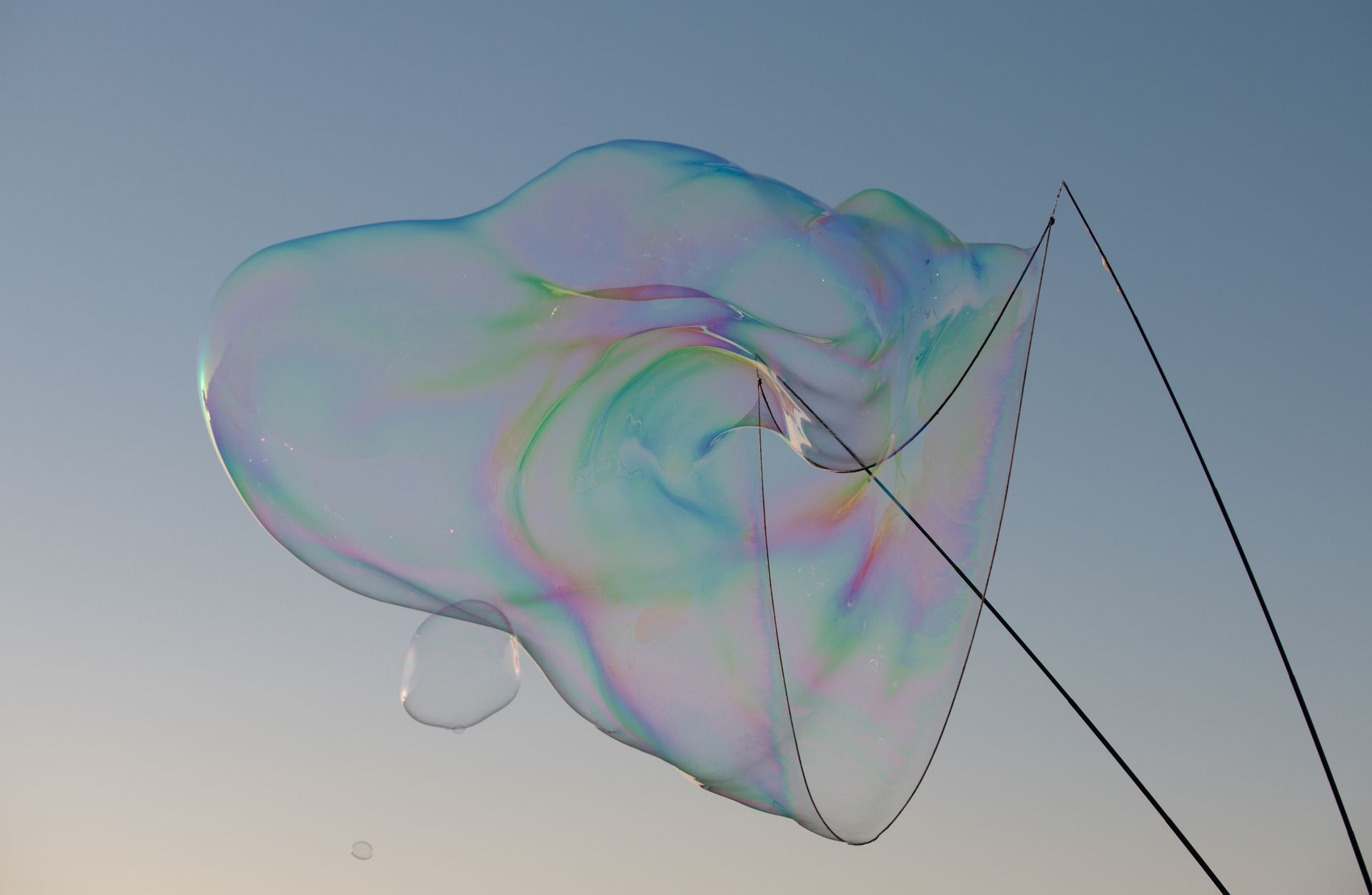 A large soap bubble is floating in the air