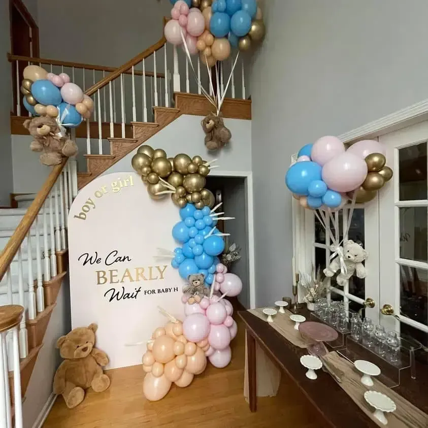 A room decorated with balloons and teddy bears for a baby shower
