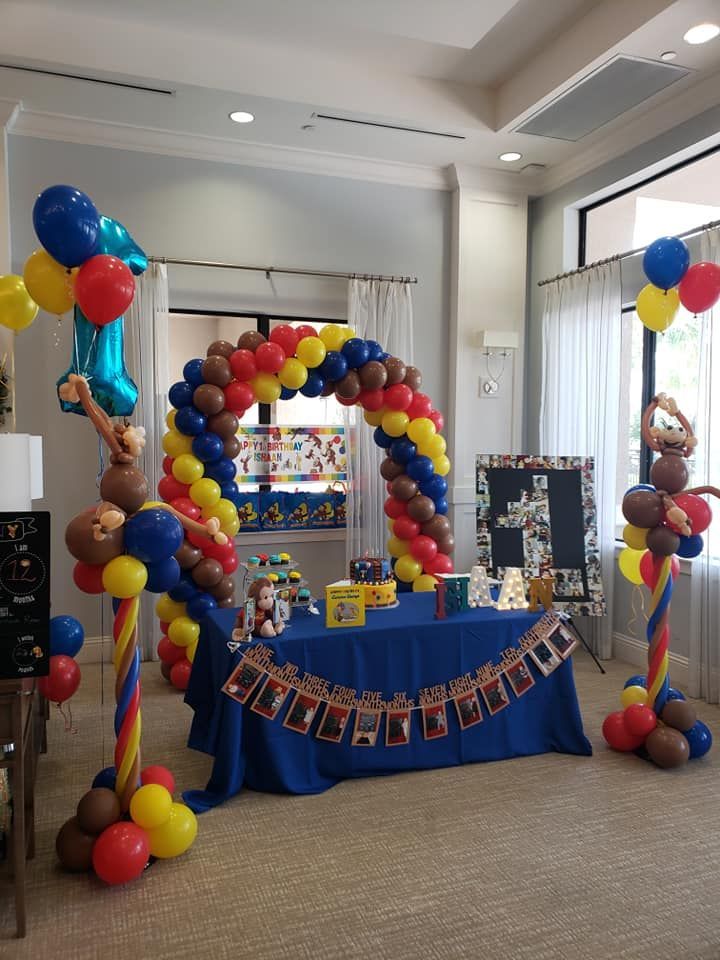 A room decorated with balloons for a birthday party