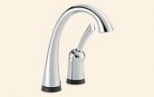 A close up of a kitchen sink faucet on a white background.
