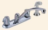 A chrome kitchen sink faucet with a sprayer attached to it.