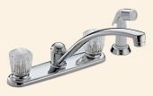 A kitchen sink faucet with a sprayer attached to it.