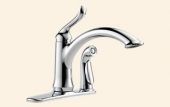 A close up of a kitchen sink faucet on a white background.