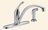 A chrome kitchen faucet with a sprayer attached to it.