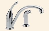 A chrome kitchen sink faucet with a sprayer attached to it.