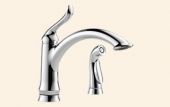 A kitchen sink faucet with a sprayer attached to it.
