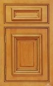A close up of a wooden cabinet door with drawers.