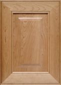 A close up of a wooden cabinet door.