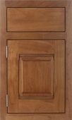 A close up of a wooden cabinet door with a drawer.