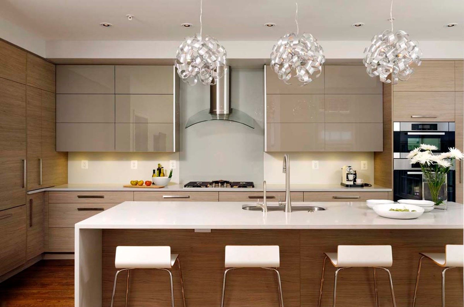A kitchen with a large island and stools