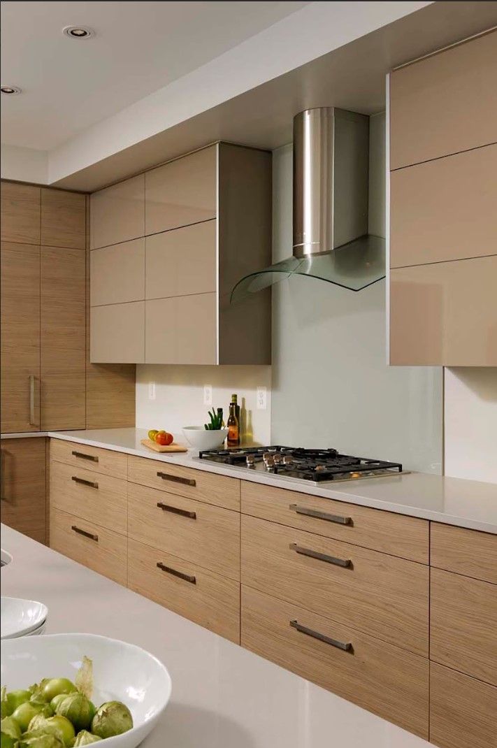 A kitchen with wooden cabinets and a stove top oven