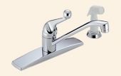 A close up of a chrome kitchen sink faucet on a beige background.
