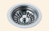 A close up of a stainless steel sink drain on a white background.