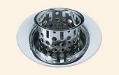 A close up of a drain with a strainer attached to it.