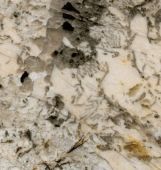 A close up of a white granite counter top.