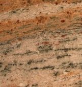 A close up of a piece of wood with a marble texture.