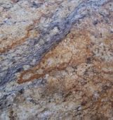 A close up of a granite counter top with a marble texture.
