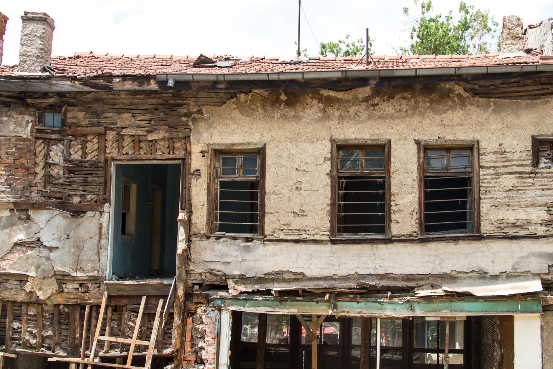 an old run down building with broken windows