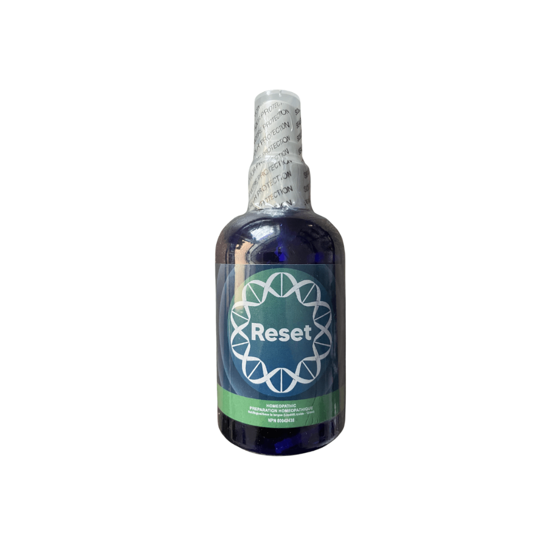 A bottle of metabolic reset spray on a white background.