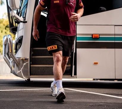 Group of People Fall in Line Outside the Bus — Keppel Coaches in Rockhampton, QLD