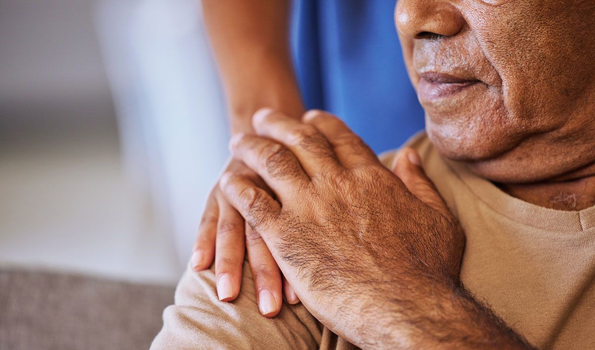 elderly woman being comforted