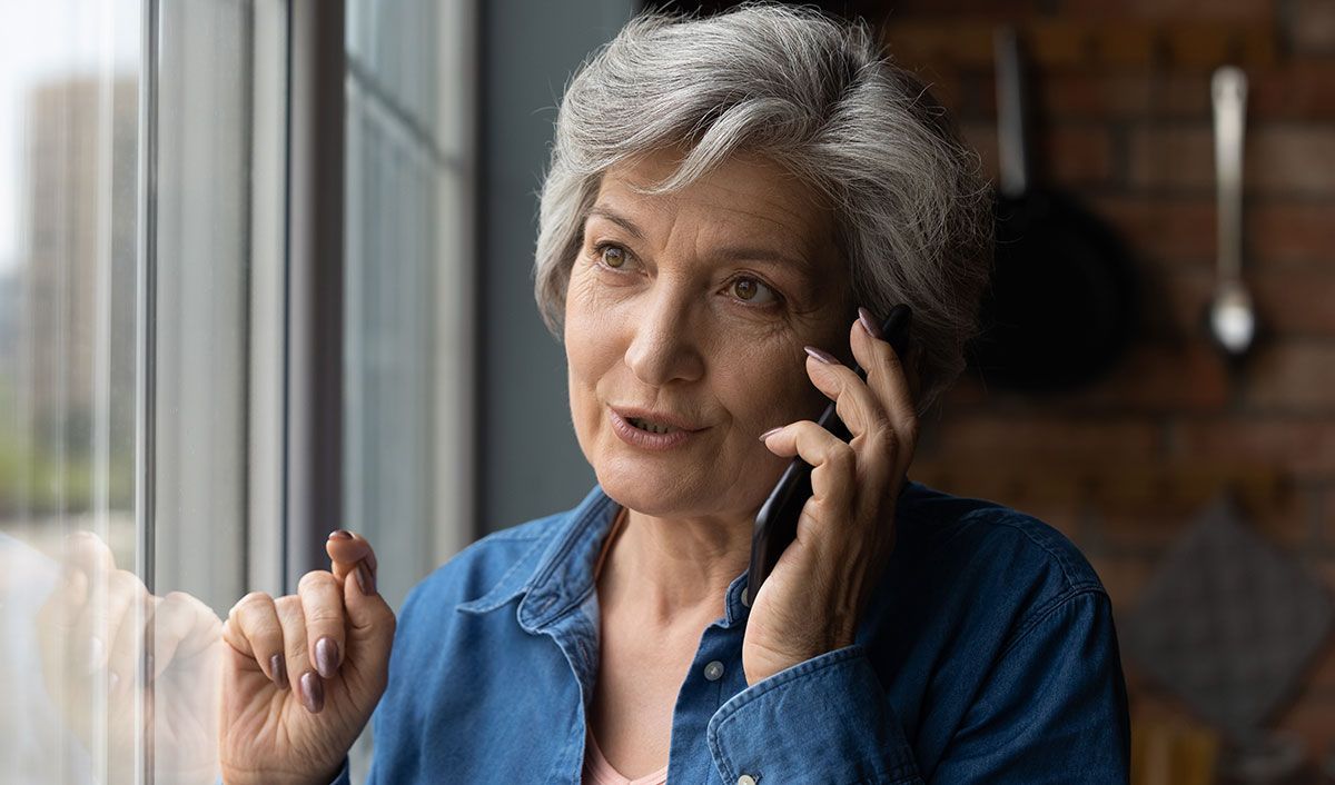 elderly woman talking on the phone