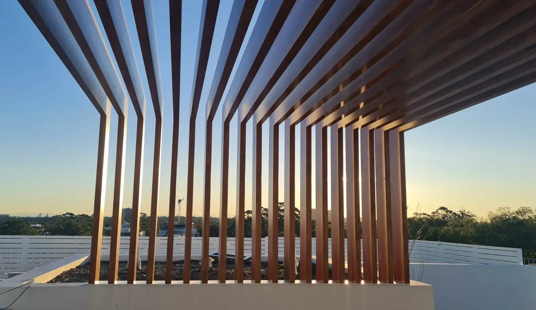 A wooden fence with a blue sky in the background