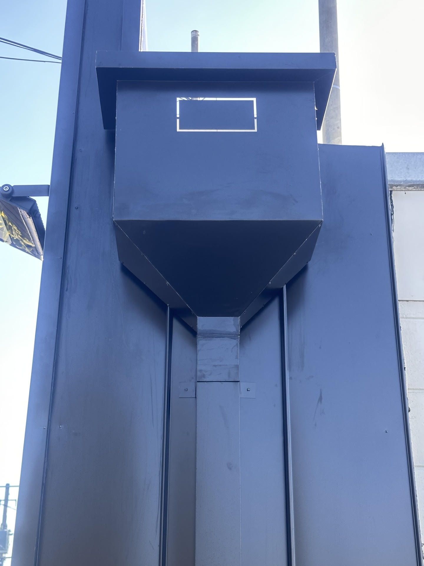 A black box with a square on the top of it