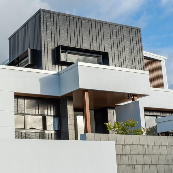 A large house with a lot of windows and a balcony