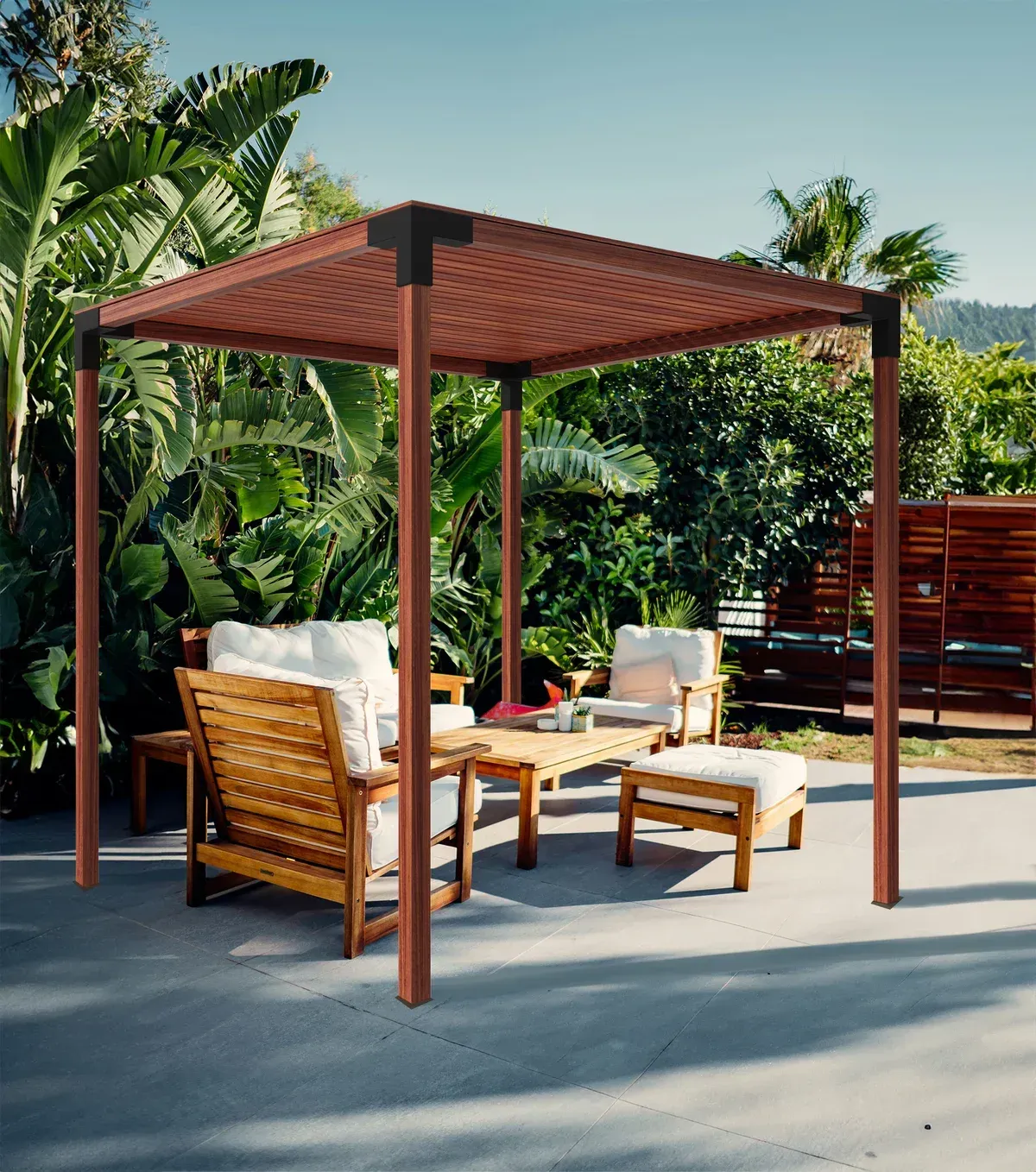 A pergola with a couch and chairs underneath it