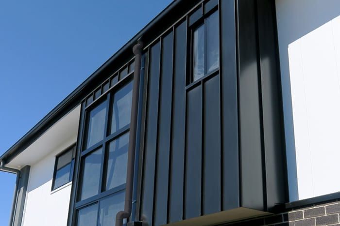 A black and white building with a lot of windows