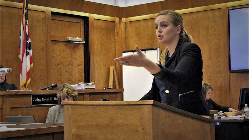woman talks at podium