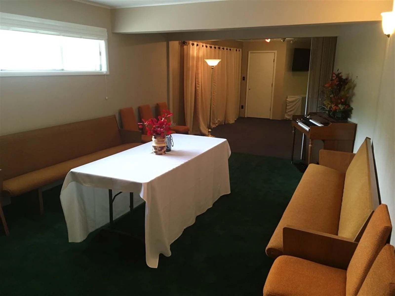 A room with a table and chairs in it.