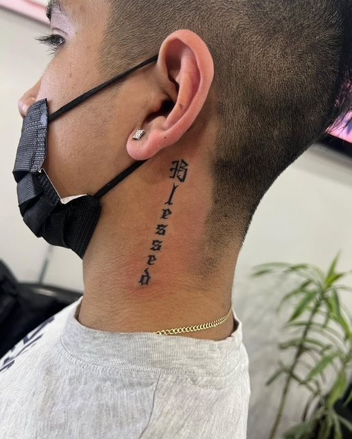 Black compass tattoo on a person's forearm, showing north, south, east, and west directions.
