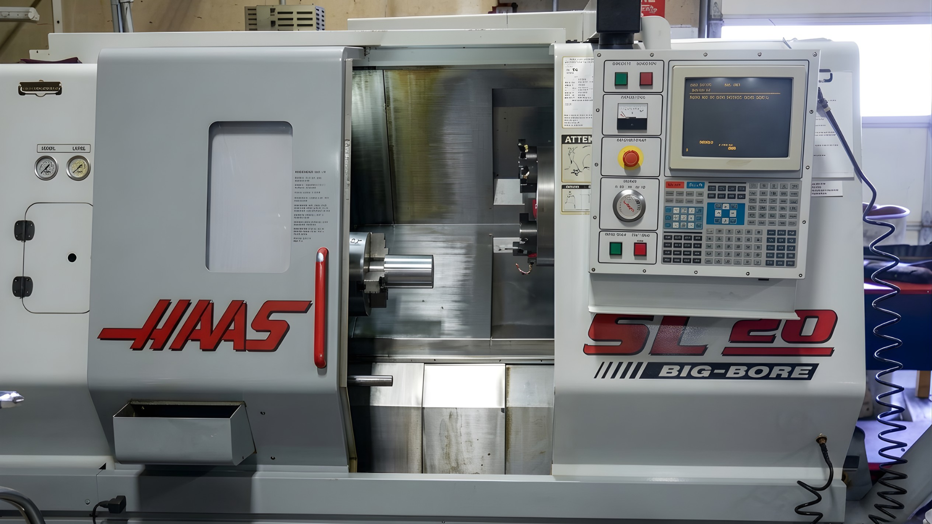 Front view of a Haas ST-20 CNC lathe with control panel and open machine chamber