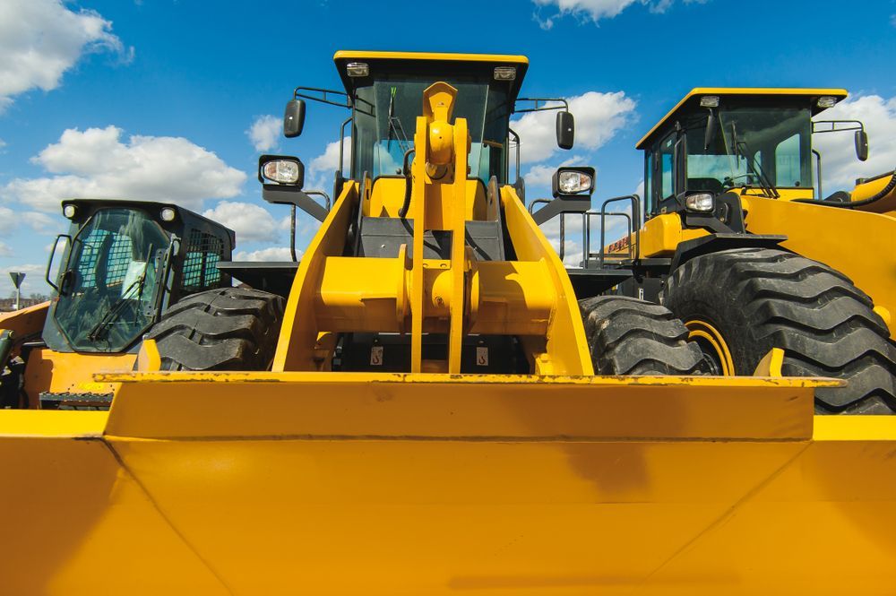 Three Yellow Front-End Loaders with Large Tires Parked Outside — Shantui QLD in Kingsthorpe, QLD