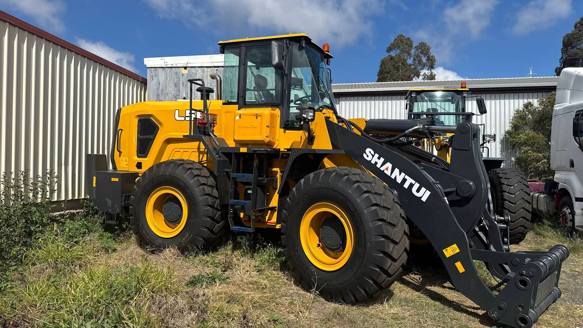 Yellow Shantui Front-End Loader Parked Outside — Shantui QLD in Kingsthorpe, QLD