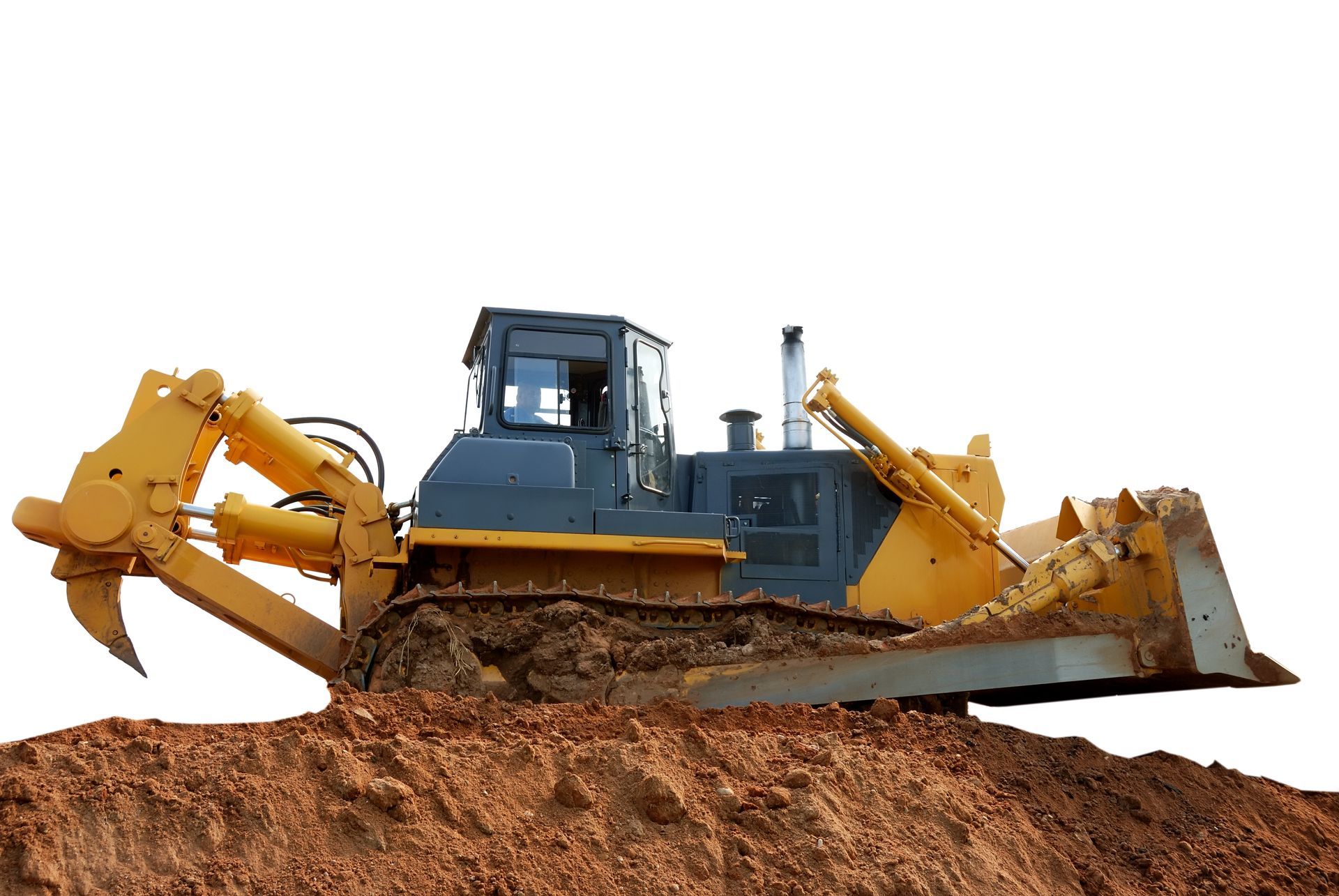 A bulldozer, yellow, grading soil on a construction site