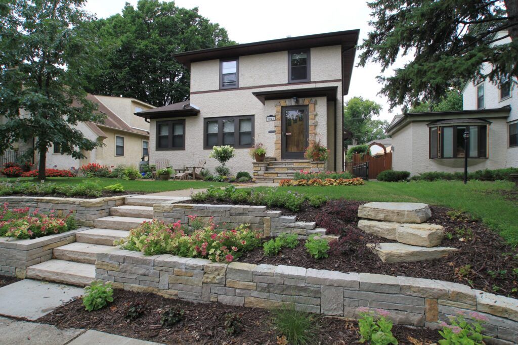 A house with stairs leading up to the front door