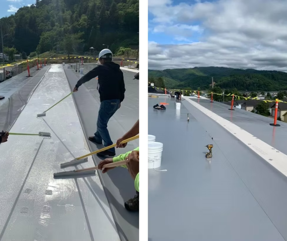 Roofers installing a gray membrane roof on a building, with tools and safety cones on a cloudy day