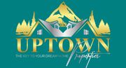 Uptown Properties logo with stylized mountain, trees, and houses in gold and teal