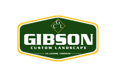 A green and yellow logo for gibson custom landscape.