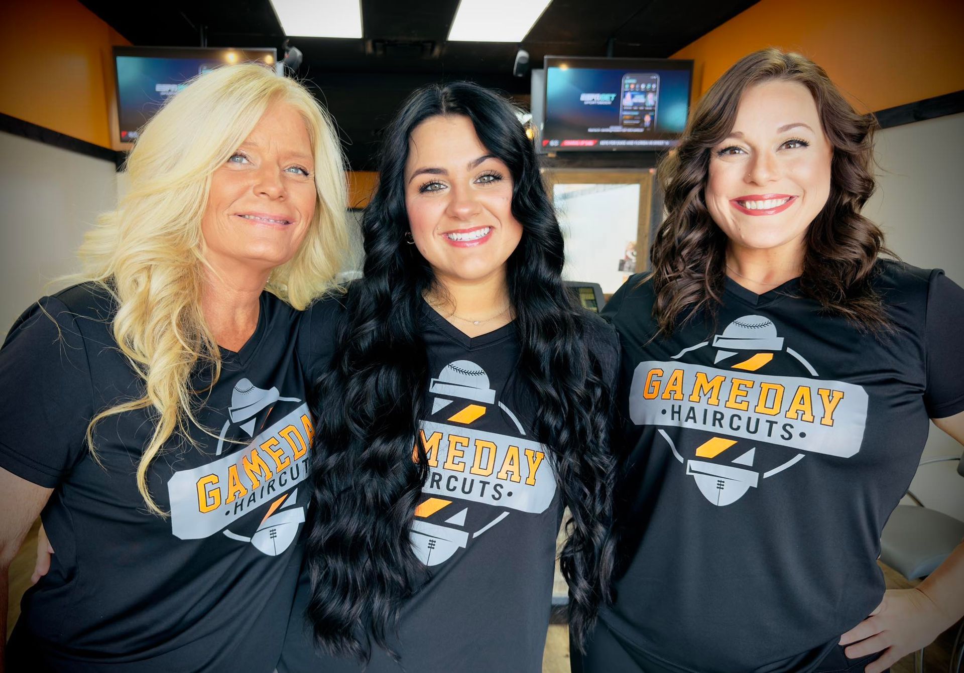 Three women wearing black 